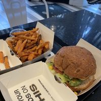 Guac burger + sweet potato fries  at Beatnic - Bleecker St in New York City