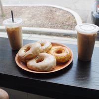 Plate of donuts and almond milk lattes at Vortex Doughnuts in Asheville