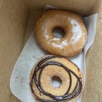 2 yeast donuts: “vanilla” glazed (top) “vortex” cinnamon sugar and chocolate swirl (bottom)  at Vortex Doughnuts in Asheville