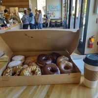 Baker's dozen, with two chai cream filled & two apple fritter filled, wich cost extra. With two coffees the total price was over $50 at Vortex Doughnuts in Asheville