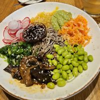 Poke bowl with eggplant, carrot, mango chutney, radish, edamame, and soba noodles at Beet in Luxembourg City