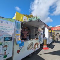 Outside at the market at Loving Hut Caravan in Nelson