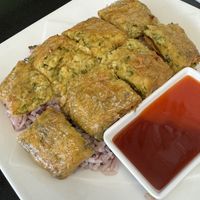 Mock “egg” omelette over ricee  at Guan Yim in Lampang