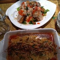Above: vegan kebap with tahini sauce. Under: seitan with smoked tofu on top in tomato sauce at Karuzo in Sarajevo