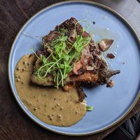 Aubergine vegan schnitzel met pepersaus at Eetcafe Spinoza in Leeuwarden