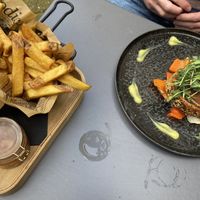 Seitan Wellington: tasty, but the structure wasn’t that meaty. The portion of fries was huge and came with mayo and very tasty apple compote. at Eetcafe Spinoza in Leeuwarden