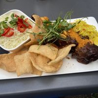 Vegan saté: nice, but too salty. The (homemade?) cassave crackers were the star of the show!  at Eetcafe Spinoza in Leeuwarden