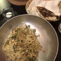 Spaghetti carbonara with bread  at NovaPizza Vegan Kitchen in Edinburgh