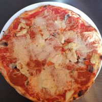 Pizza with ham, pepperoni, artichoke at NovaPizza Vegan Kitchen in Edinburgh