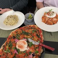 Upper left: cacio e pepe. Upper right: fusilli novapizza. Center: caprese pizza  at NovaPizza Vegan Kitchen in Edinburgh