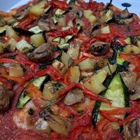 Pizza with mushrooms, red bell pepper, courgette and roasted potatoes at NovaPizza Vegan Kitchen in Edinburgh