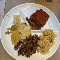 Parmigiana flora, potato gratin, pasta with potatoes, rice with peas  at Flora in Verona