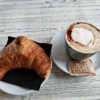 Nougat croissant and soy cappuccino at Feliz Cafe in Peschiera Del Garda