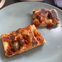 Focaccia con olive taggiasche e pomodorini   at Feliz Cafe in Peschiera Del Garda