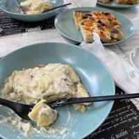 Mushroom lasagna and olive and tomato focaccia   at Feliz Cafe in Peschiera Del Garda