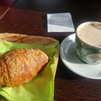 soy latte and croissant at Feliz Cafe in Peschiera Del Garda