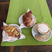 Pistachio and hazelnut chocolate cream croissants and a cappuccino at Feliz Cafe in Peschiera Del Garda