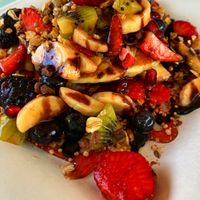 Pancake stack with fresh fruit at Feliz Cafe in Peschiera Del Garda