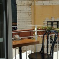 seating on the balcony at Pane e Souvlaki in Corfu