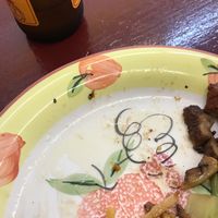 Liters of fat on my almost empty plate.. very greasy food  at Blossoming Lotus in Newtown