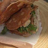 Vegan panino with vegan mortadella and chickpea cheese at Vegan Store Stall 83 in Rome