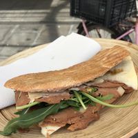 Vegan panino on reusable plate at Vegan Store Stall 83 in Rome