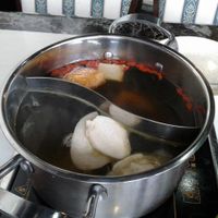 2 choice of different flavour of soup in a pot at Yummy Veggie in East Singapore