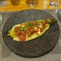 Grilled egplant with tomato, soft tofu and herbs at Banlle in Siem Reap