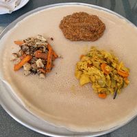 Yemisir Kay Wat - red lentils, sauteed with onions in a spicy berbere sauce; Gomen Alicha  — carrots, cabbage & potatoes simmered in mild turmeric-based sauce; and cauliflower.  at Zemam's in Tucson