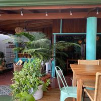 Super cute place. Outdoor and indoor seating and some hanging chairs outside. They also have a store inside with a lot of really cute local/handmade clothes! at Organico Fortuna in La Fortuna