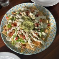 Loaded Nachos with lots of guacamole, refried beans and cashew sour cream   at Organico Fortuna in La Fortuna