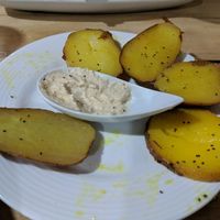 side of potatoes with surprise macademia "cheese" at Organico Fortuna in La Fortuna