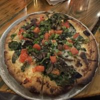 The Terra firma with GF crust and vegan mozzarella. One of the best pizzas I have ever eaten! Was like a white clam pizza!   at Red Tractor Pizza in Bozeman