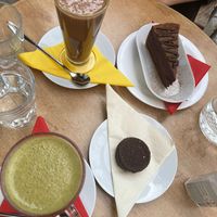 Cookie, cake, matcha latte and cacao latte  at bistRAW & Tea in Prague