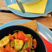 fresh salad with tomato and avocado at bistRAW & Tea in Prague