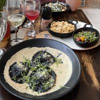 Black ravioli, Mac and cheese, tempeh, Caesar salad  at Full Bloom in Miami Beach