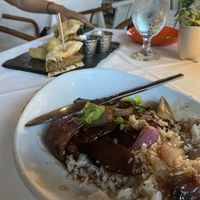 seitan/potato dish in front and vegan burger in back (friend was not impressed with the burger)  at Full Bloom in Miami Beach