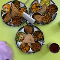 3 platters of chickpeas, plant protein, empanadas, salad, cauliflower, and more at Hare Krishna Buffete in Monterrey