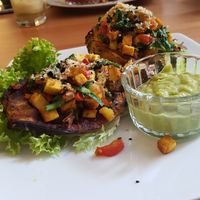 Sweet potatoes filled with tofu and veggies and guac siding at BIOFresh in Timisoara