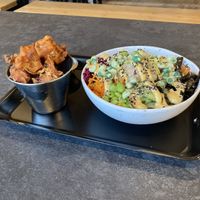 Popcorn cauliflower with satay sauce and salmon with a kick sushi bowl  at Happy Maki in Brighton