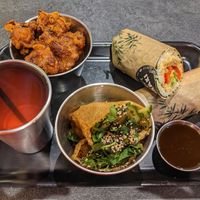 Hoisin duck sushi burrito, popcorn cauliflower, loaded tofu pockets, sparkling raspberry and rosemary cordial at Happy Maki in Brighton