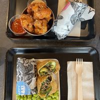 Popcorn cauliflower, sushi burrito on top, bento box on bottom  at Happy Maki in Brighton