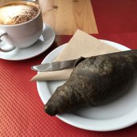 Soya cappuccino and vegan charcoal croissant at Purezza, Brighton.-from 2016 March, please check updated menu to see if this is still available or not at Purezza in Brighton