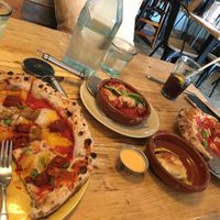 Sausage pizza, meatballs, dough balls  at Purezza in Brighton