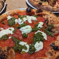 Pizza with pesto and vegan stracciatella at Purezza in Brighton