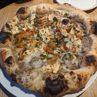 The best pizza I've ever had!! - with black truffle base, mushrooms, vegan camembert. at Purezza in Brighton
