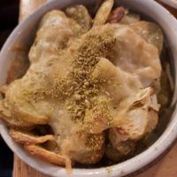 Garlic potatoes. Quite tasty. My wife wanted them crispy, I thought they were good as they were. at Purezza in Brighton