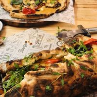 Gf pizza and calzone (bottom) at Purezza in Brighton