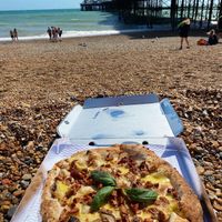 “The one that’s telling porkies” - White base with melted cheddar, mixed wild forest mushrooms, marinated pulled BBQ pieces and sundried tomatoes. at Purezza in Brighton