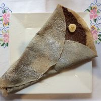 Buckwheat crepe with vegan chocolate-hazelnut spread and sliced banana  at Cafe Baumgarten in Fuessen
